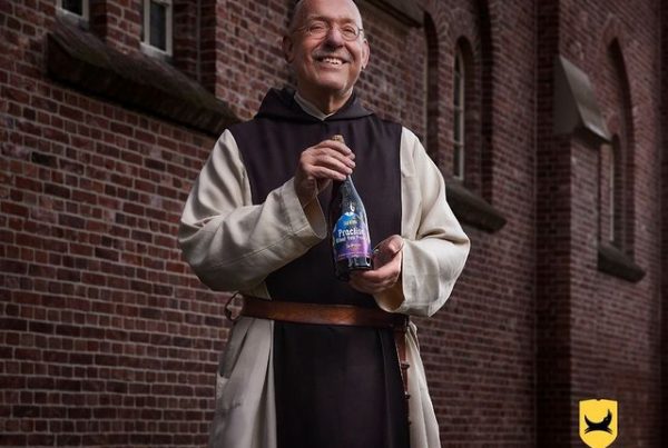 Monk holds La Trappe Practise what you preach